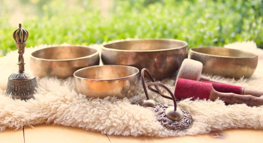 4 Tibetan singing bowls placed on a blanket
