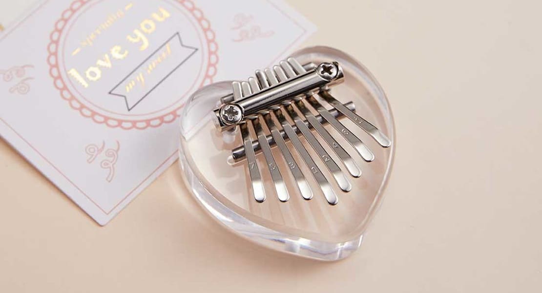 A heart-shaped acrylic kalimba