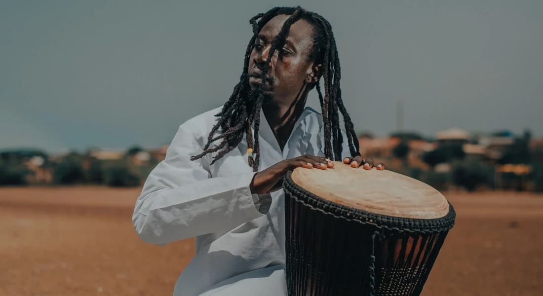 An African playing a djembé