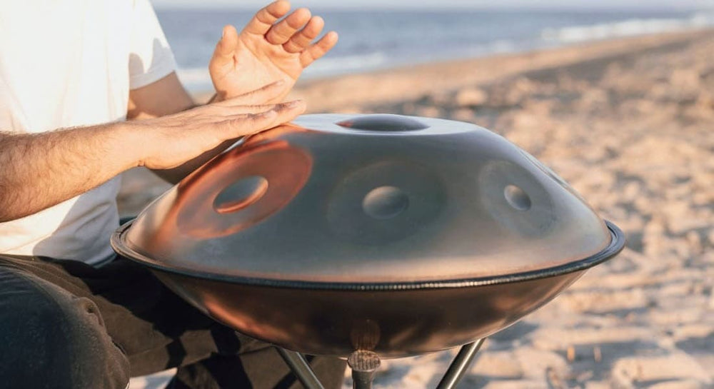 Close-up of a handpan percussionist on the beach