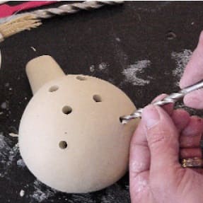 Drilling the ocarina holes