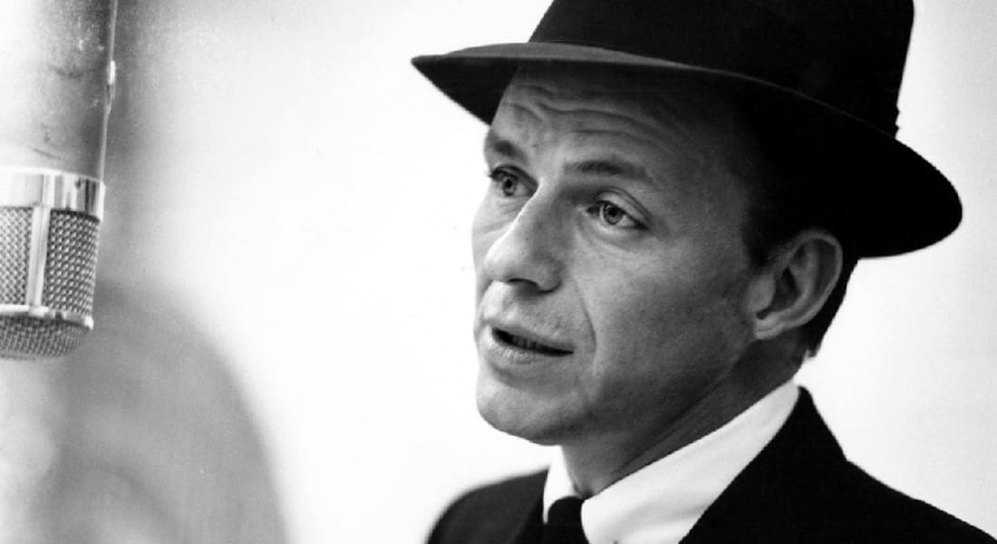 Frank Sinatra singing with a microphone