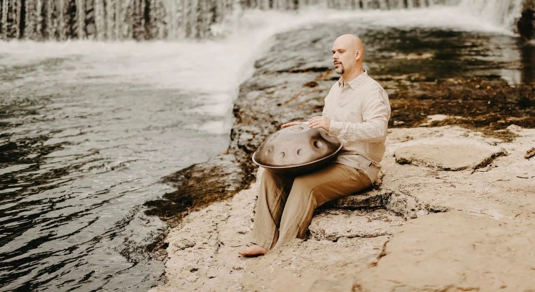 Musician Jeremy Arndt playing a handpan