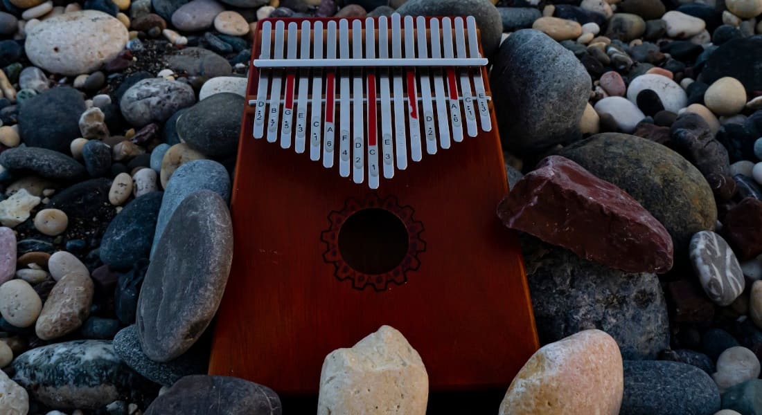 A kalimba on pebbles