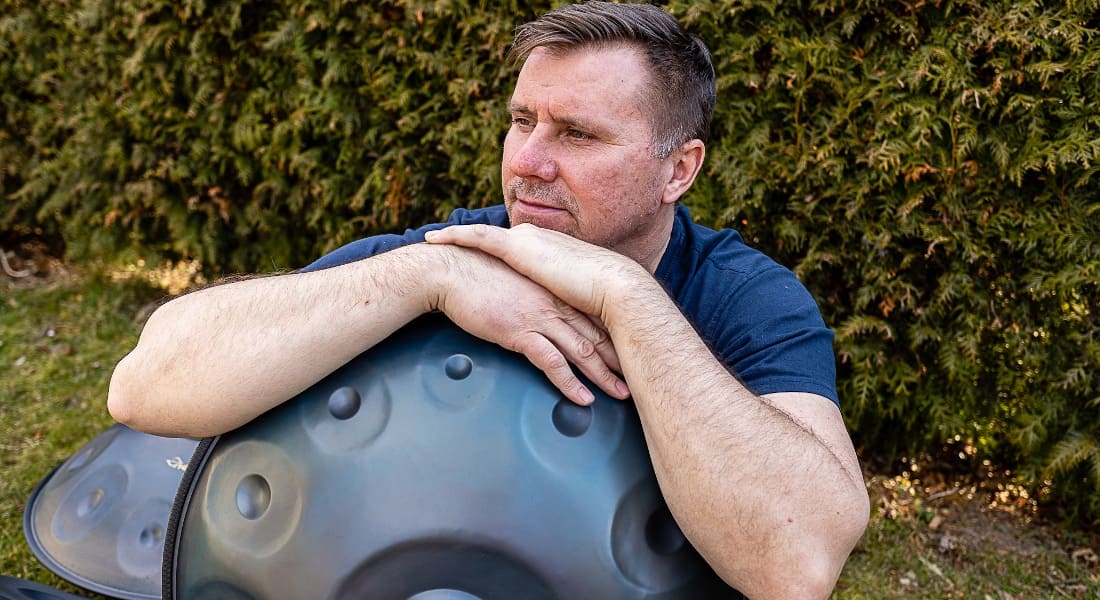 A man in a zen state with a handpan
