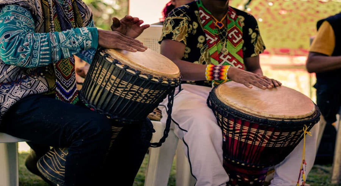 Men playing the djembe