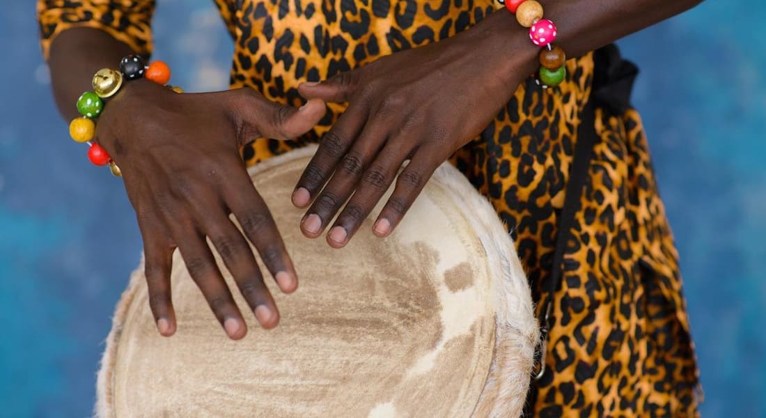 A person playing a djembe
