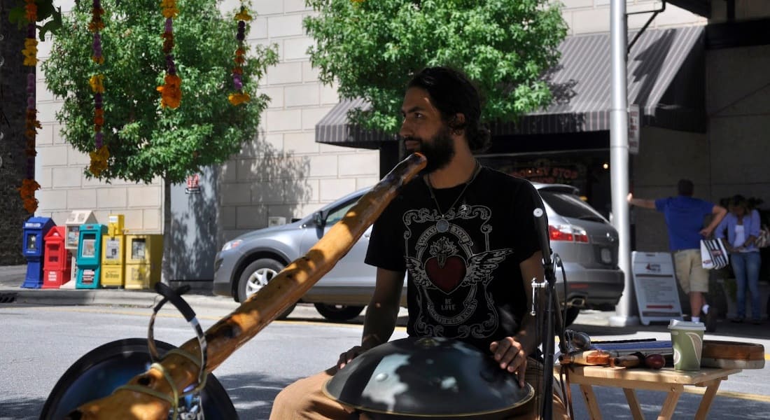 Peter Levitov playing on the street with a handpan