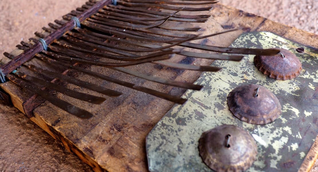 A rusty traditional mbira with metal caps
