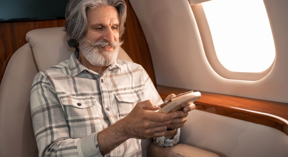A smiling senior man playing the kalimba