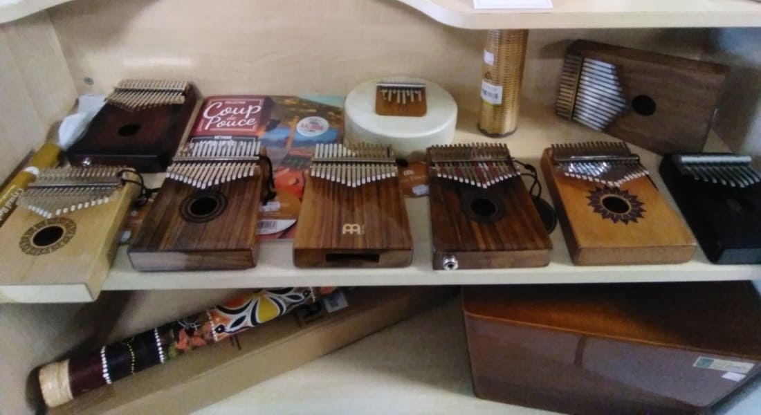 Several kalimbas on a shelf