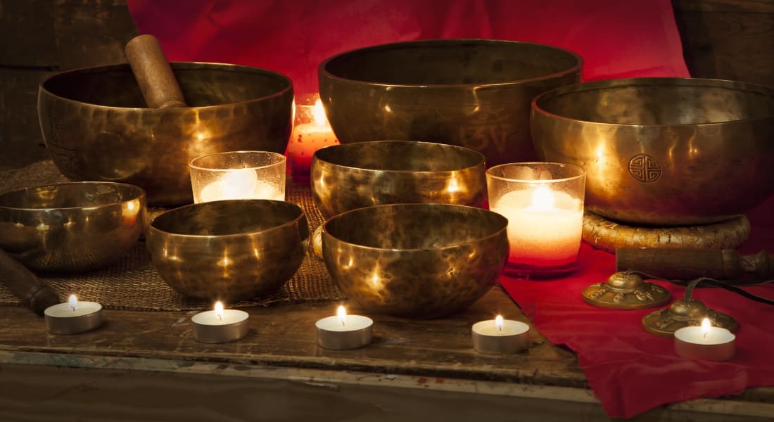 Several real Tibetan singing bowls on a table