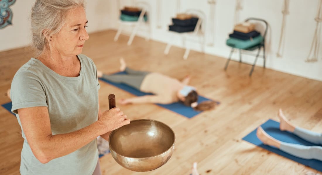 A sound therapy session with a Tibetan singing bowl.