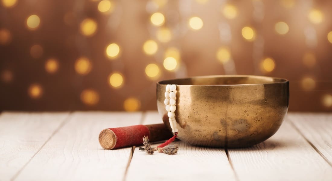 A Tibetan singing bowl on a white table