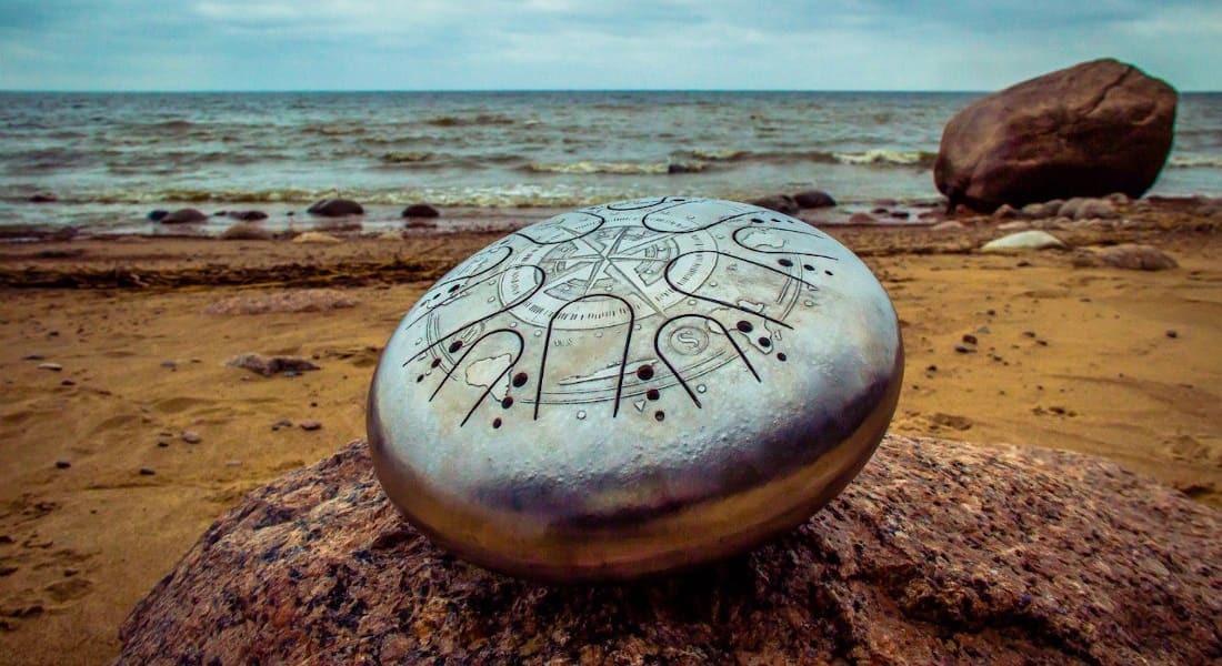 A tongue drum on rocks at the beach