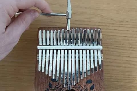 Tuning a note that's too high with a kalimba hammer