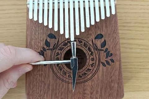 Tuning a note that's too low with a kalimba hammer