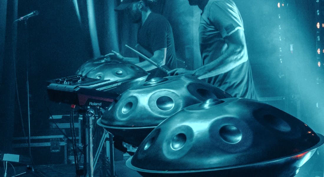 Two handpan players recording music