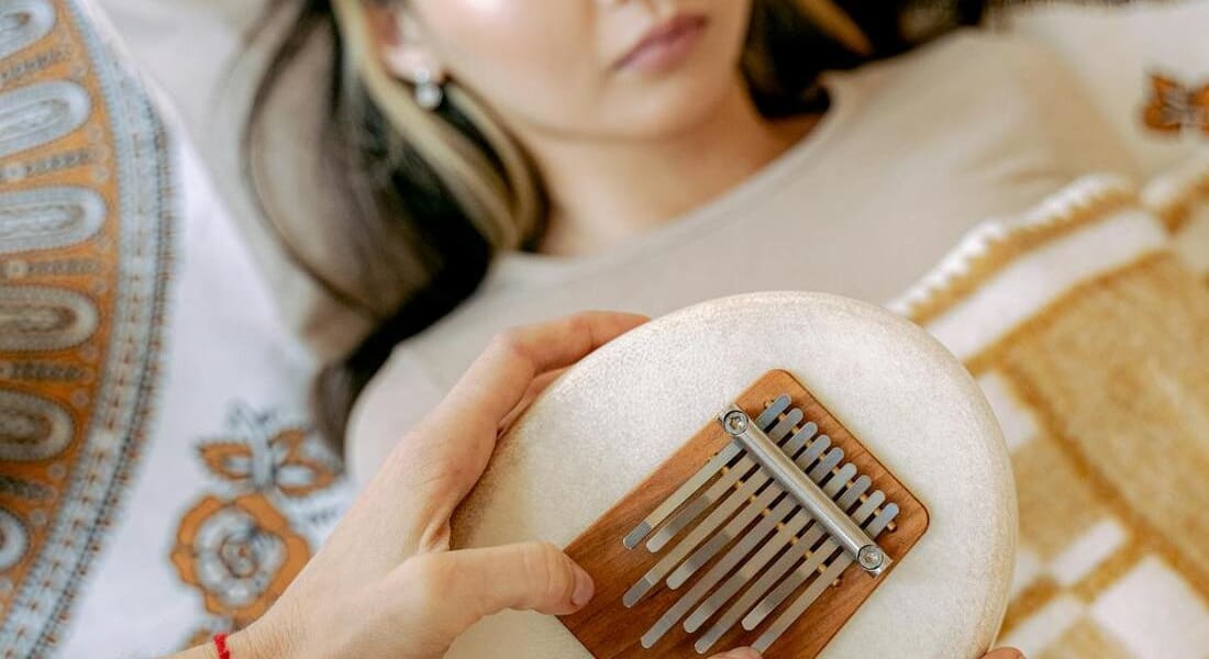 A woman enjoying a sound therapy session