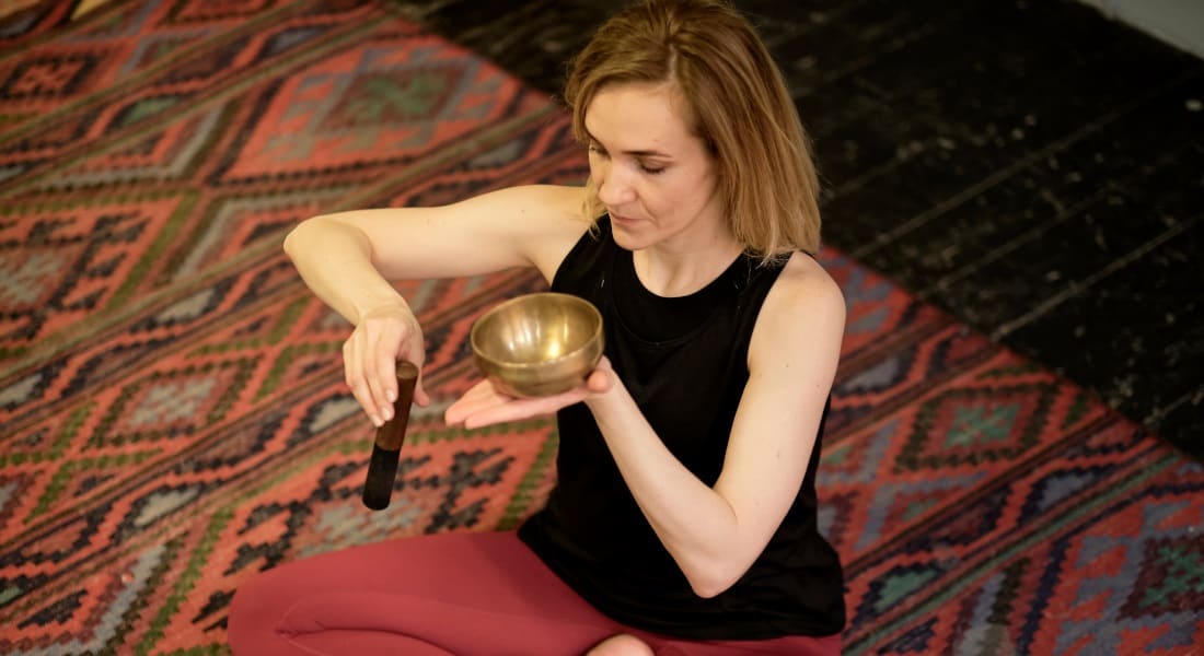 A woman in Tibetan singing bowl training