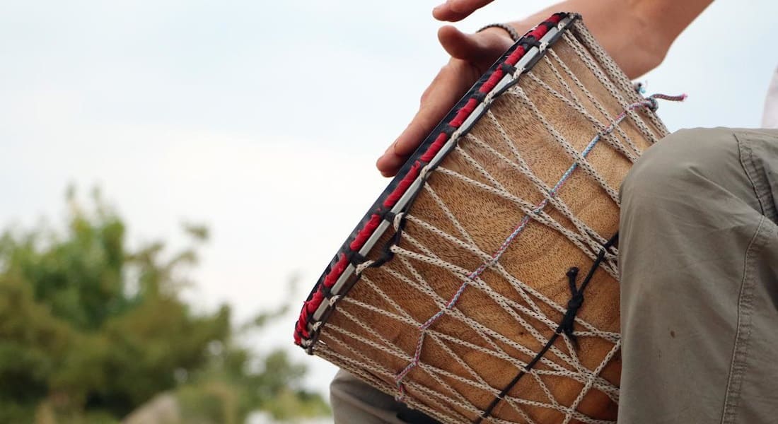 A beautiful wooden djembe with ropes