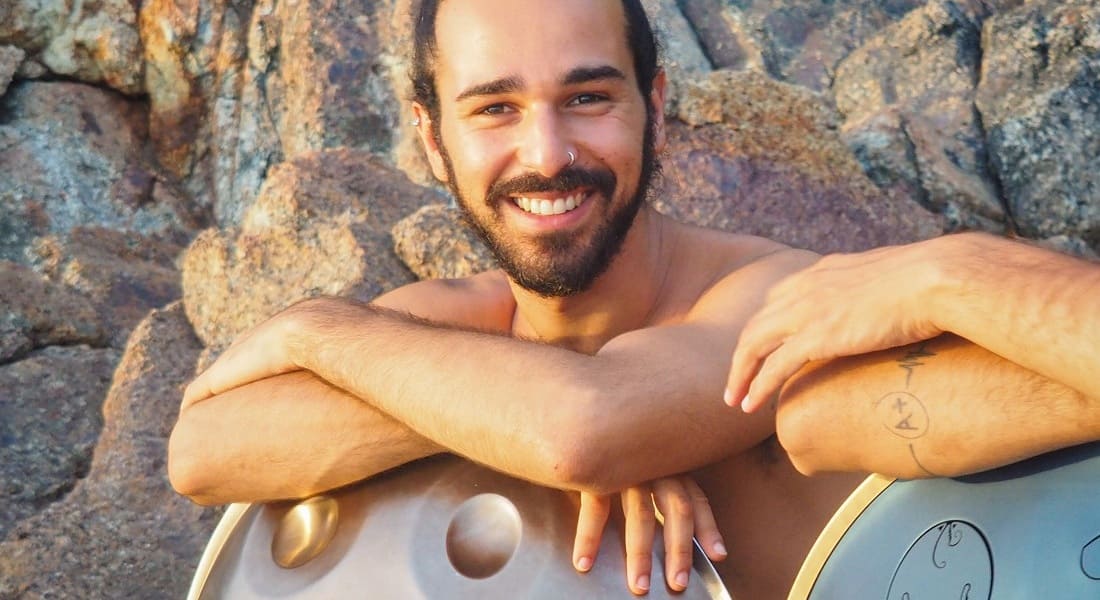 Yuval Babayoff smiling with a handpan