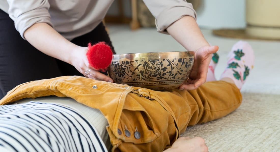 A Tibetan singing bowl placed on the legs