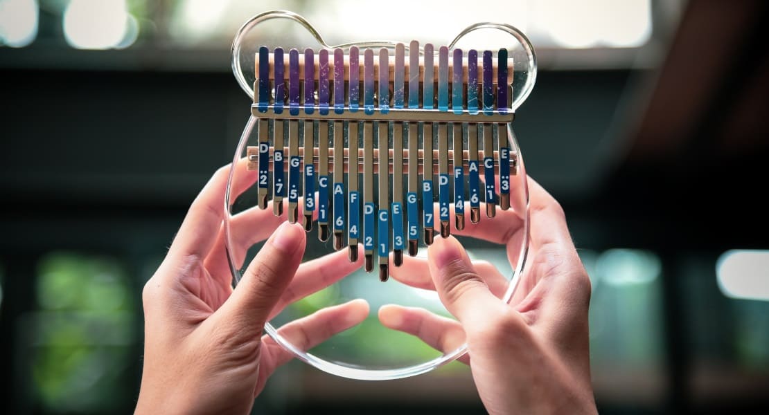 An acrylic kalimba held in hand