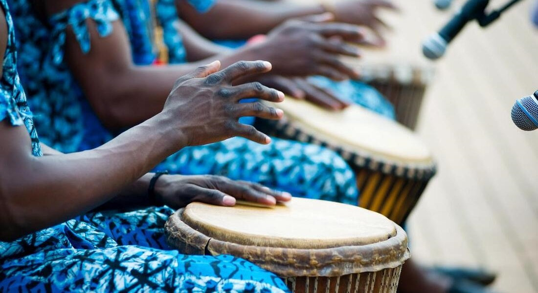 A group of African musicians playing the djembe