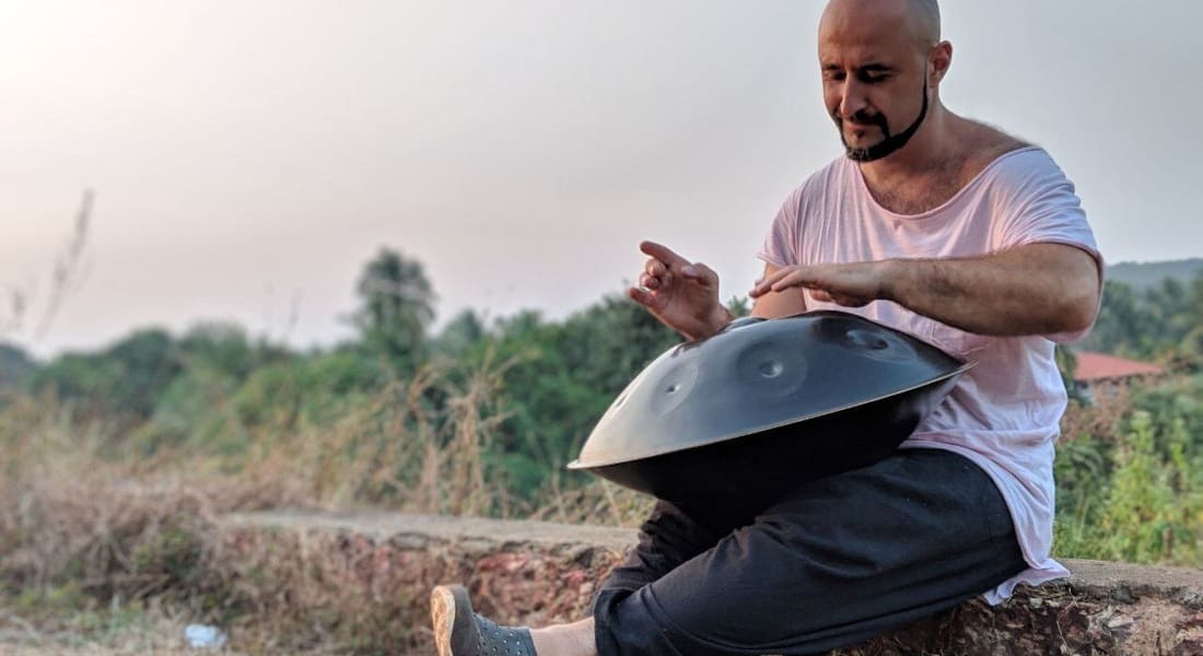 A musician from the Animara project playing the handpan