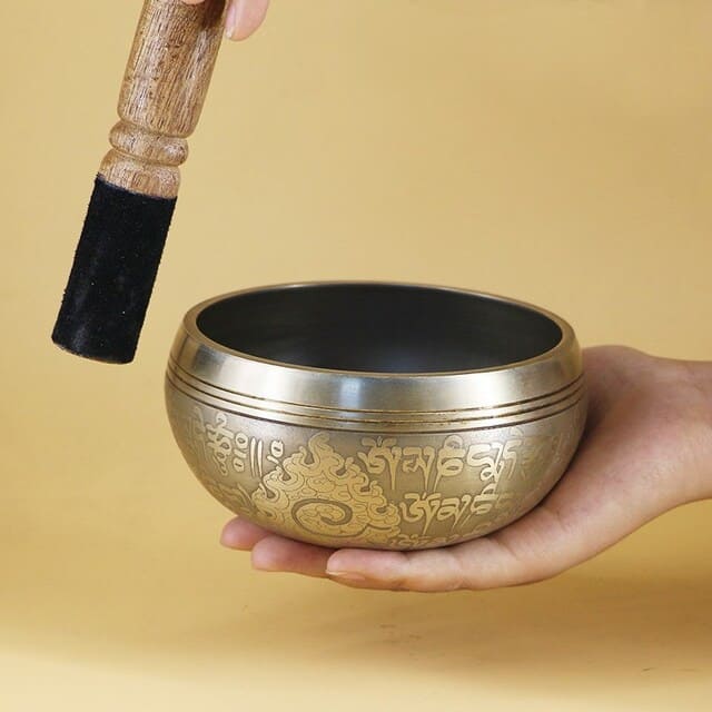 Bol tibétain chantant avec baton