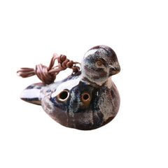 A bird-shaped carved ocarina