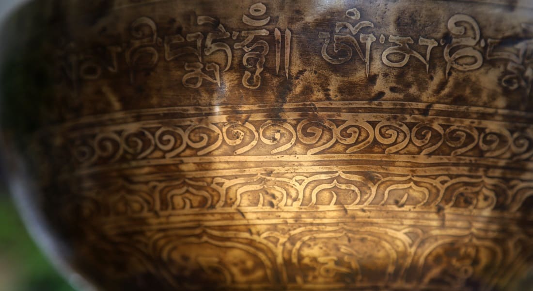 Close-up of an engraved Tibetan singing bowl