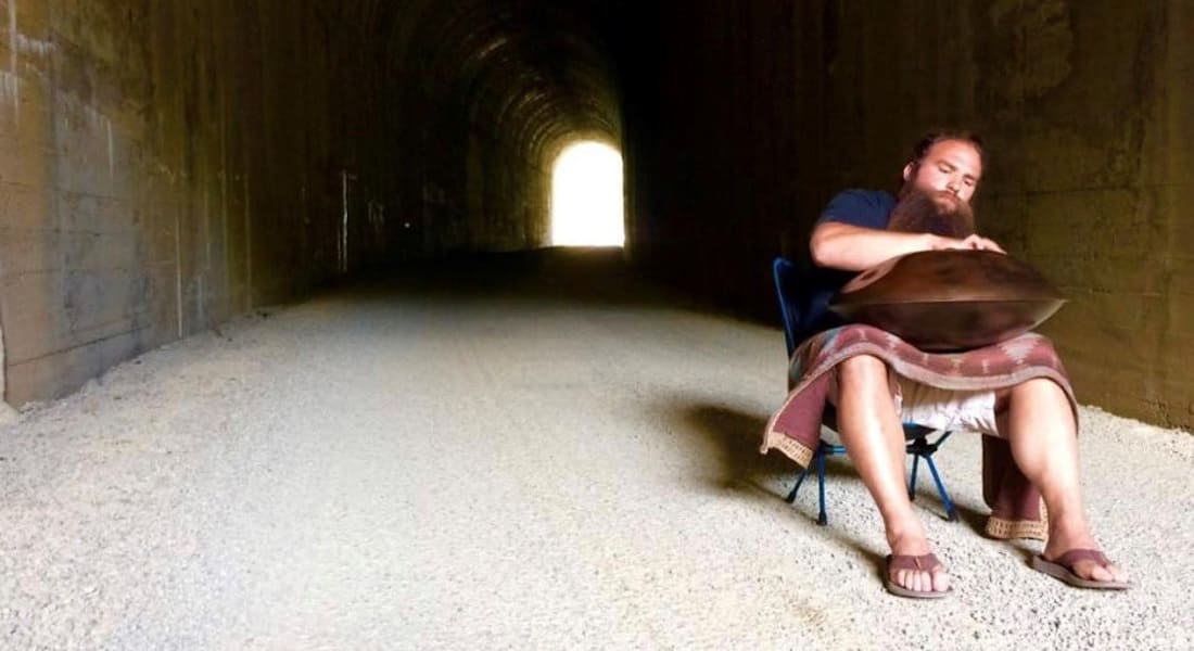 Ethereal in E playing the handpan under a bridge