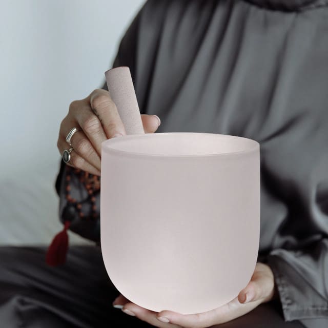 Frosted singing bowl held in hand