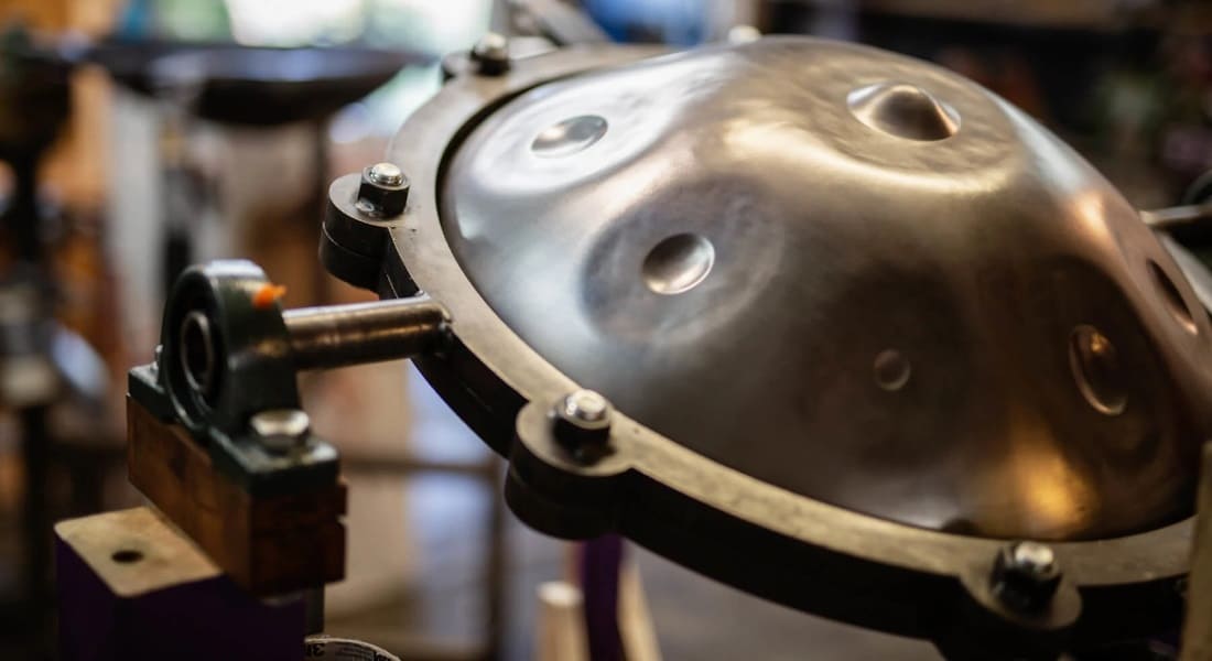 A handpan at a craftsman's workshop for tuning