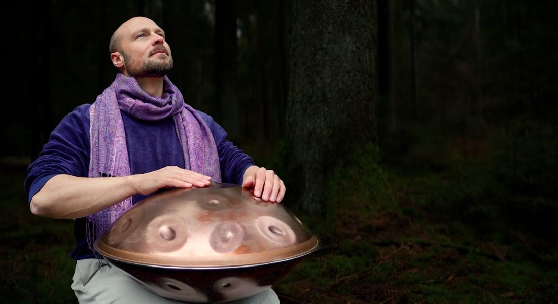 Johan Immanuel playing the handpan in the forest