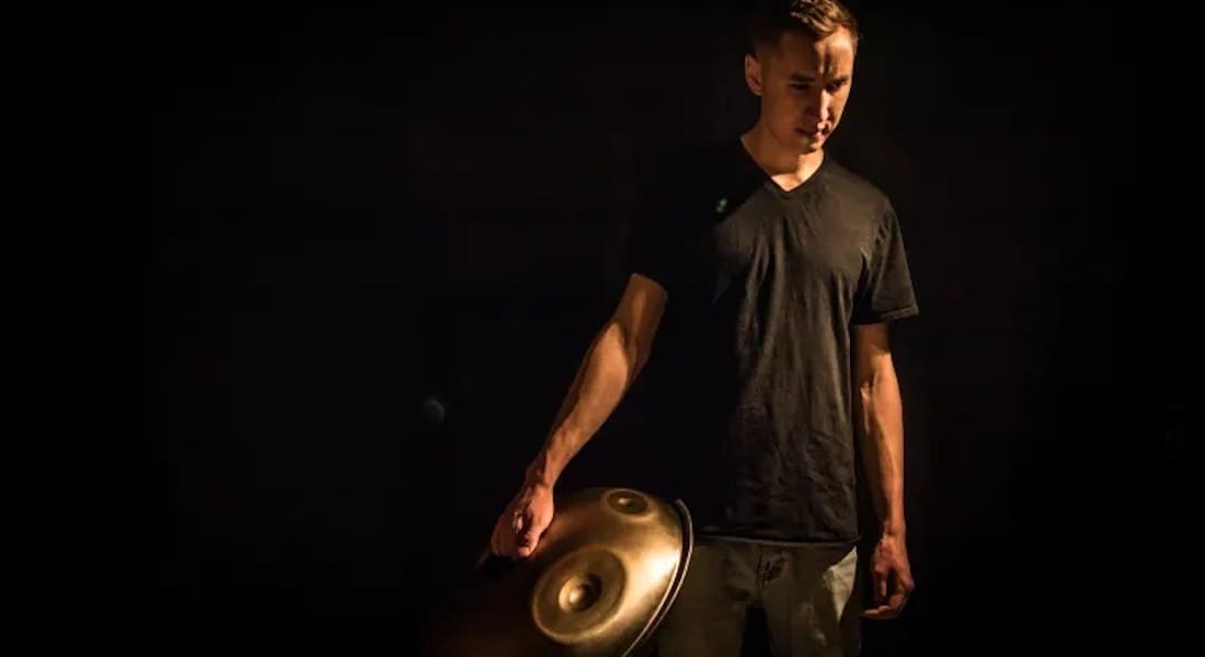 Mark D'Ambrosio holding a handpan