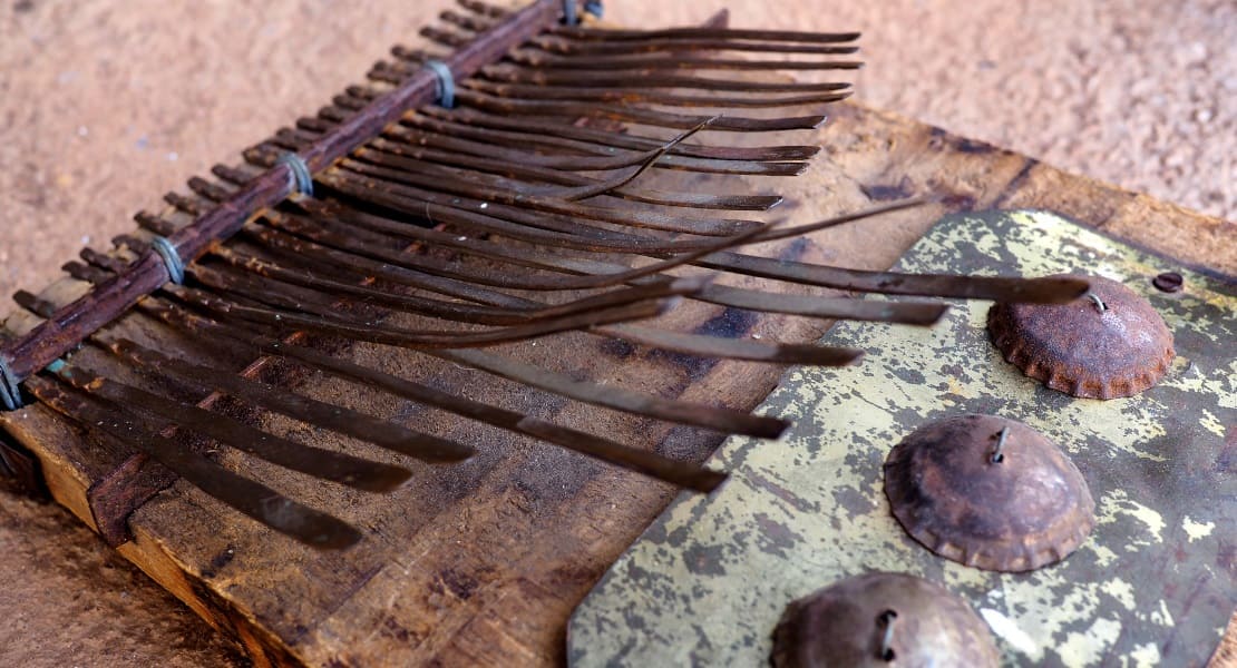 A traditional mbira with bottle caps