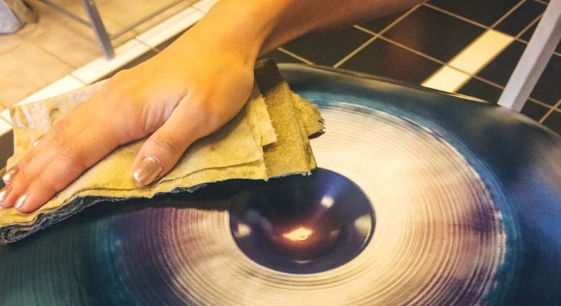 Musician wiping their handpan