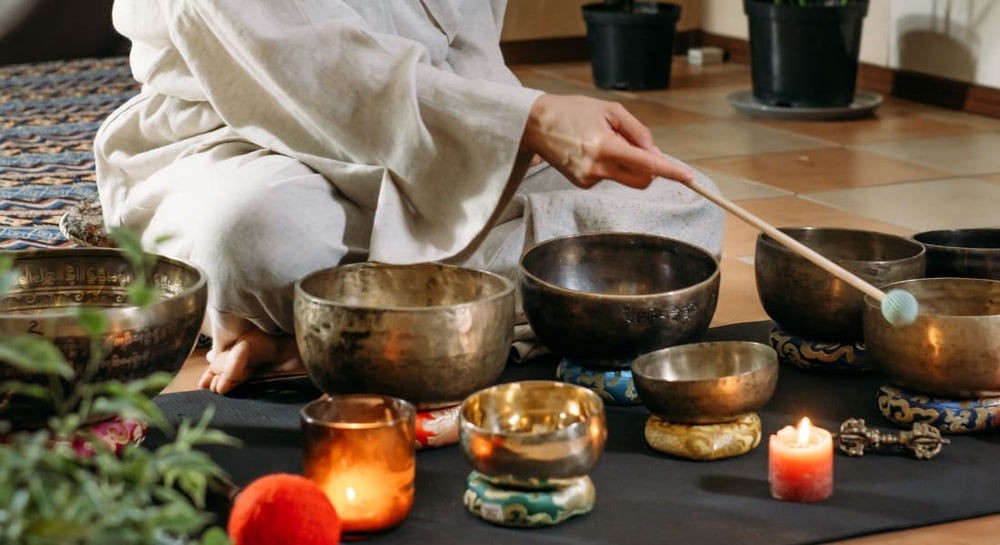 Several singing bowls resting on ring-shaped cushions