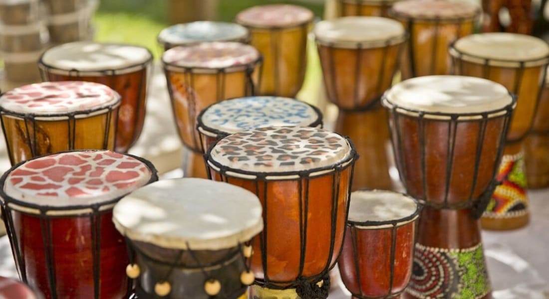 Several small djembes on the floor