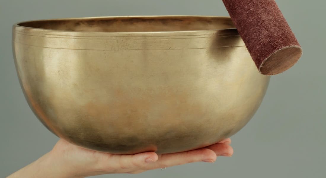 A singing bowl with a mallet