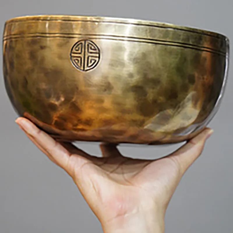 Full Moon Tibetan singing bowl held in hand