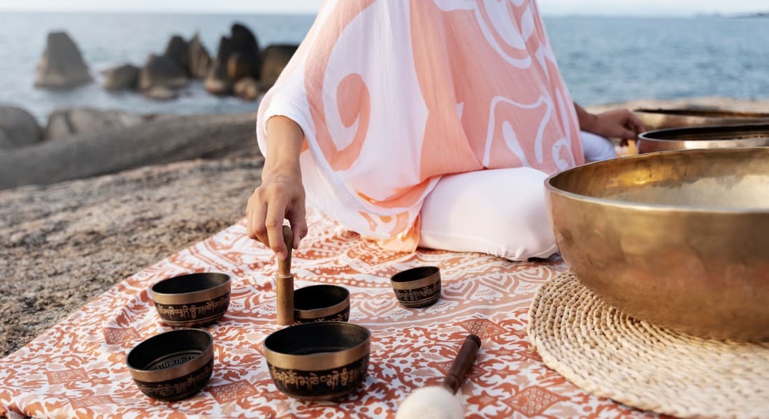 A Tibetan singing bowl concert on a beach