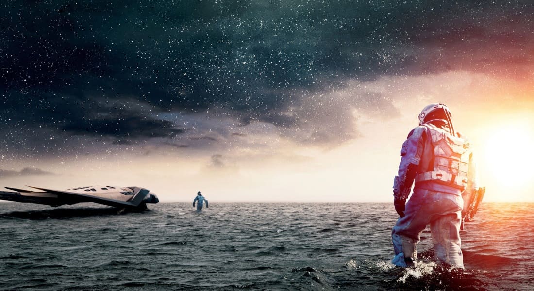 Two astronauts on a planet with a spacecraft