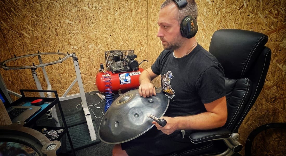 Valerio Menon tuning a handpan