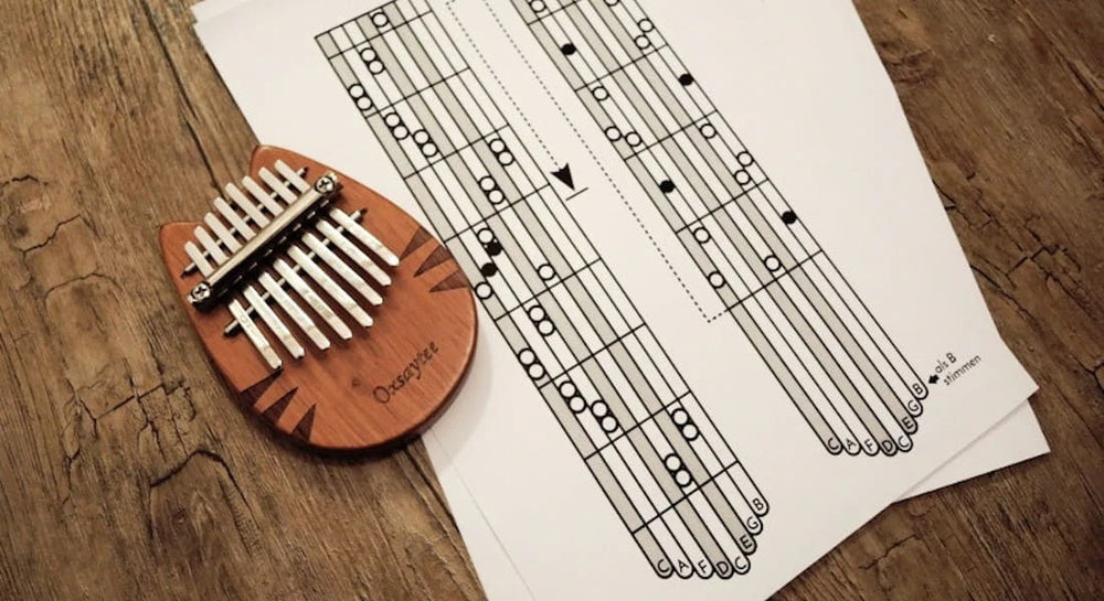 A wooden kalimba with a tablature